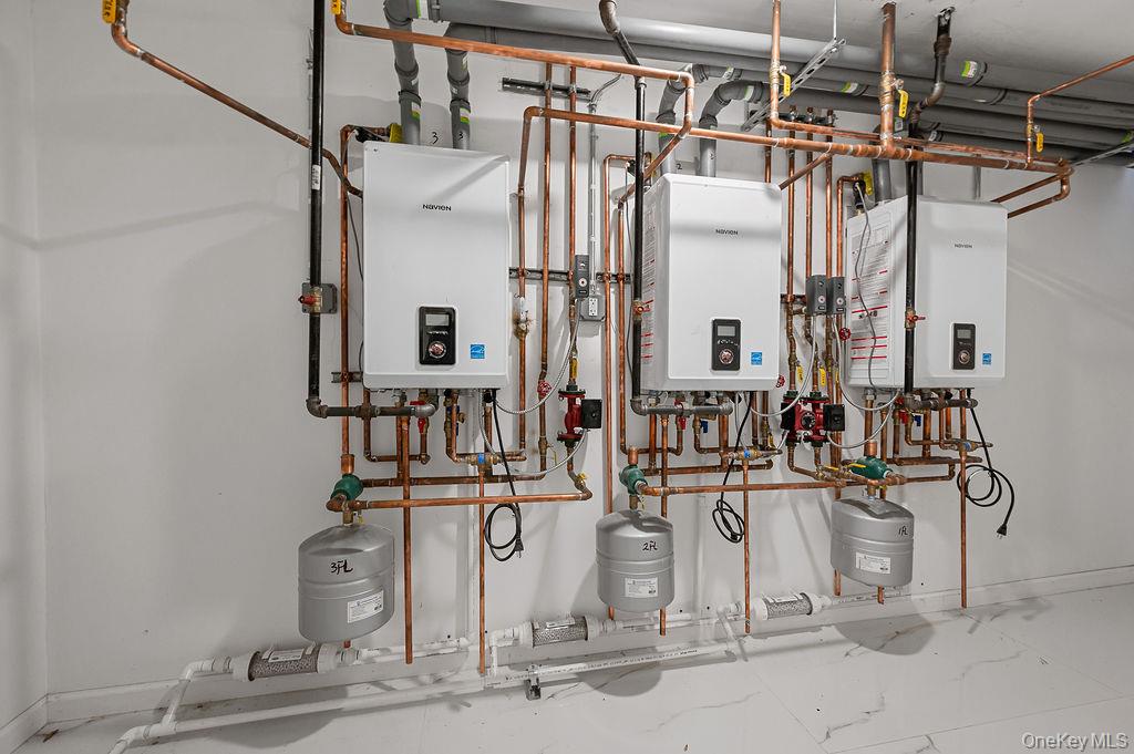 106-05 49th Avenue Queens, NY 11368 - Photo 31 of 39 a view of a kitchen with white cabinets