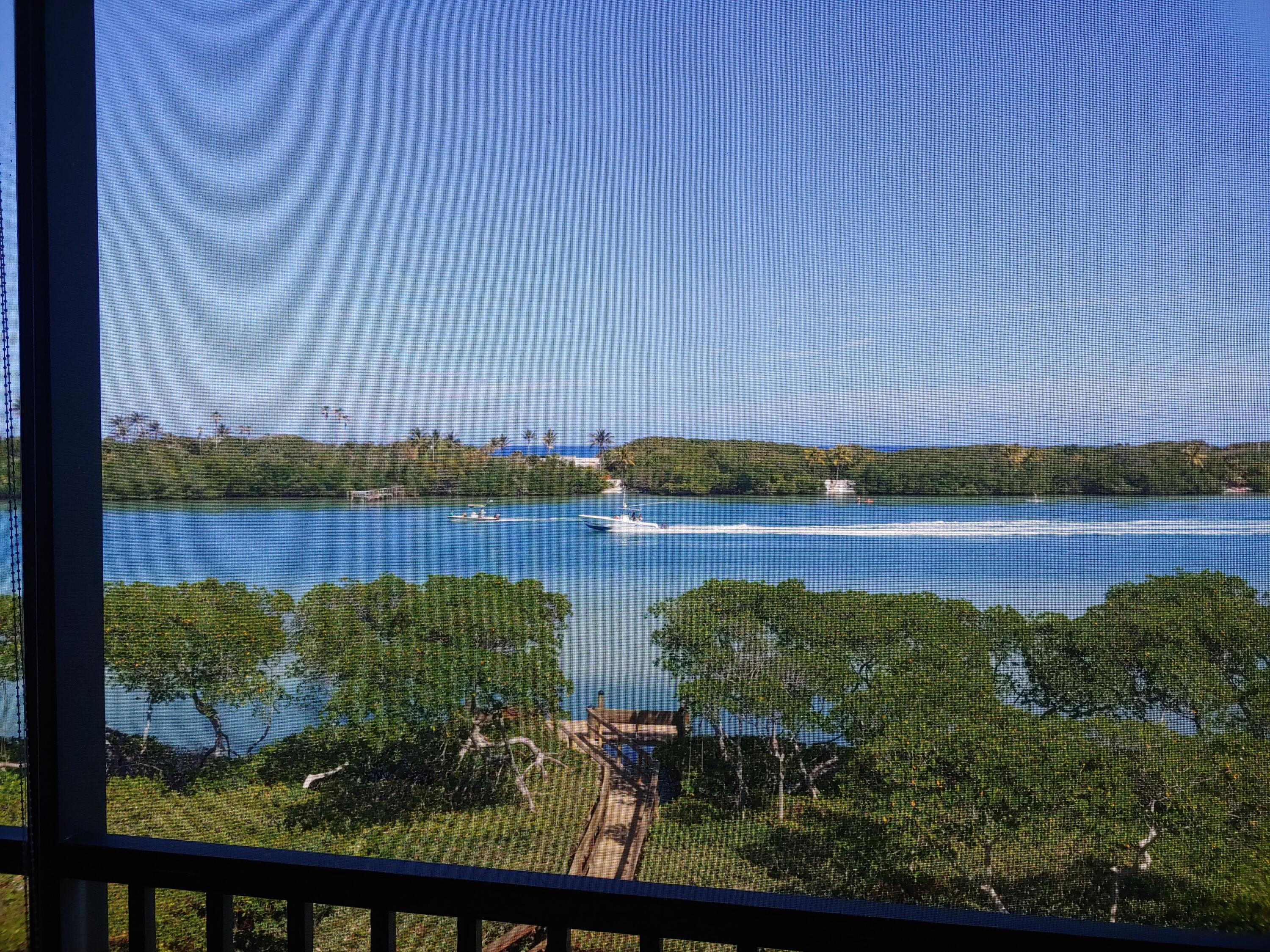 200 Waterway Road, Unit 307 Tequesta, FL 33469 - Photo 1 of 8 a view of lake with city view