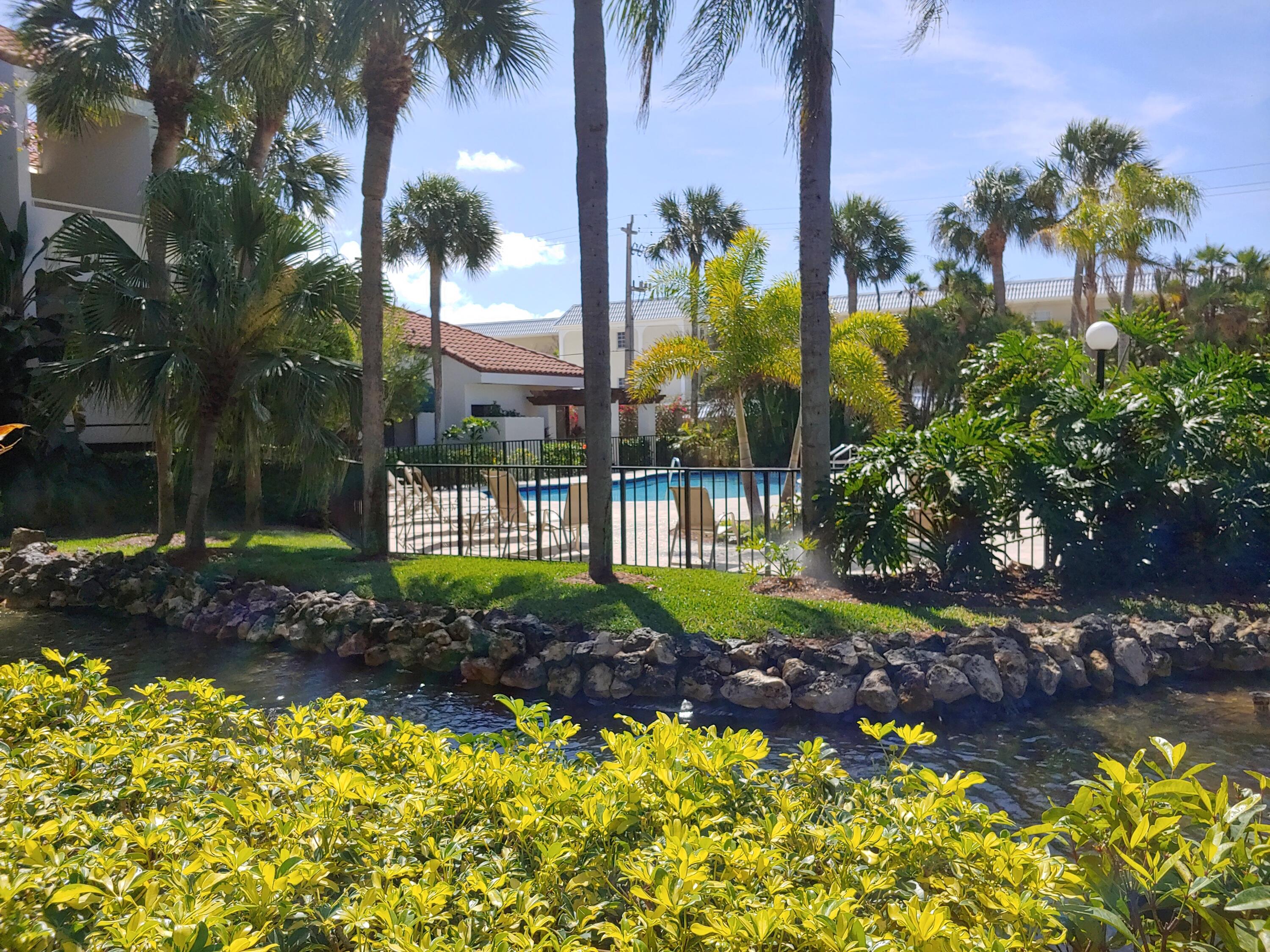 200 Waterway Road, Unit 307 Tequesta, FL 33469 - Photo 8 of 8 a view of a back yard