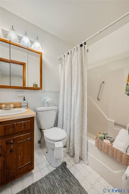 25205 Ritchie Avenue Petersburg, VA 23803 - Photo 20 of 30 Hexagonal tile flooring, warm wood-finish vanity,