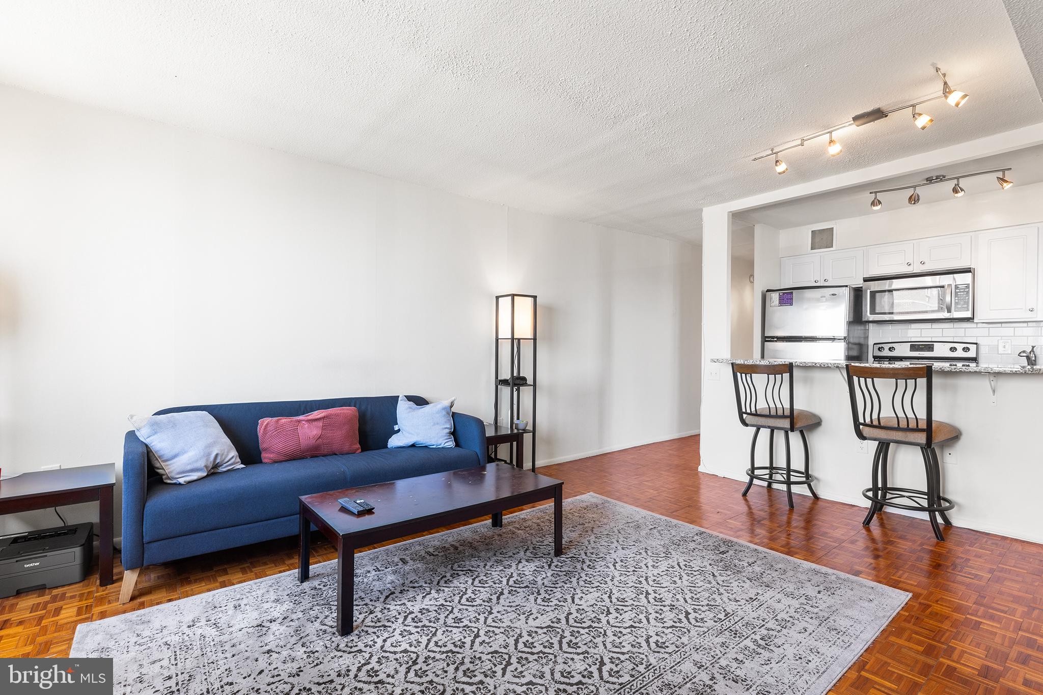 1420 Locust Street, Unit 29J Philadelphia, PA 19102 - Photo 20 of 30 a living room with furniture and wooden floor