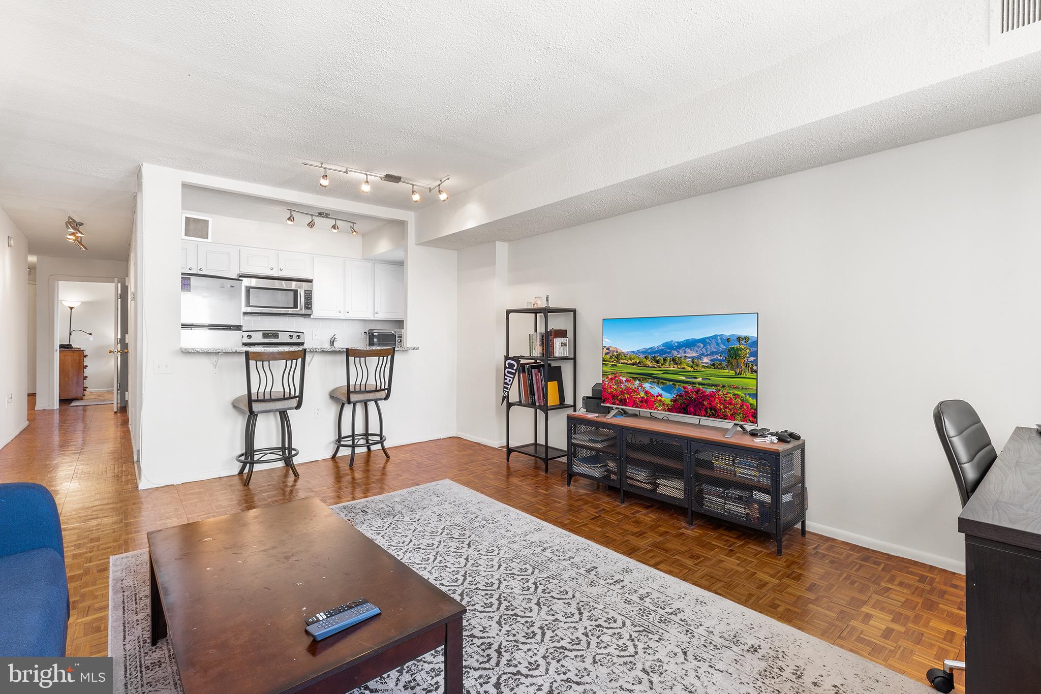 1420 Locust Street, Unit 29J Philadelphia, PA 19102 - Photo 21 of 30 a living room with furniture and a flat screen tv