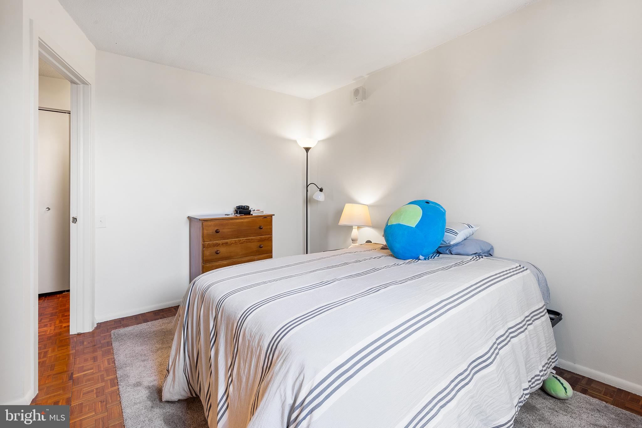 1420 Locust Street, Unit 29J Philadelphia, PA 19102 - Photo 27 of 30 a bedroom with a bed and a closet