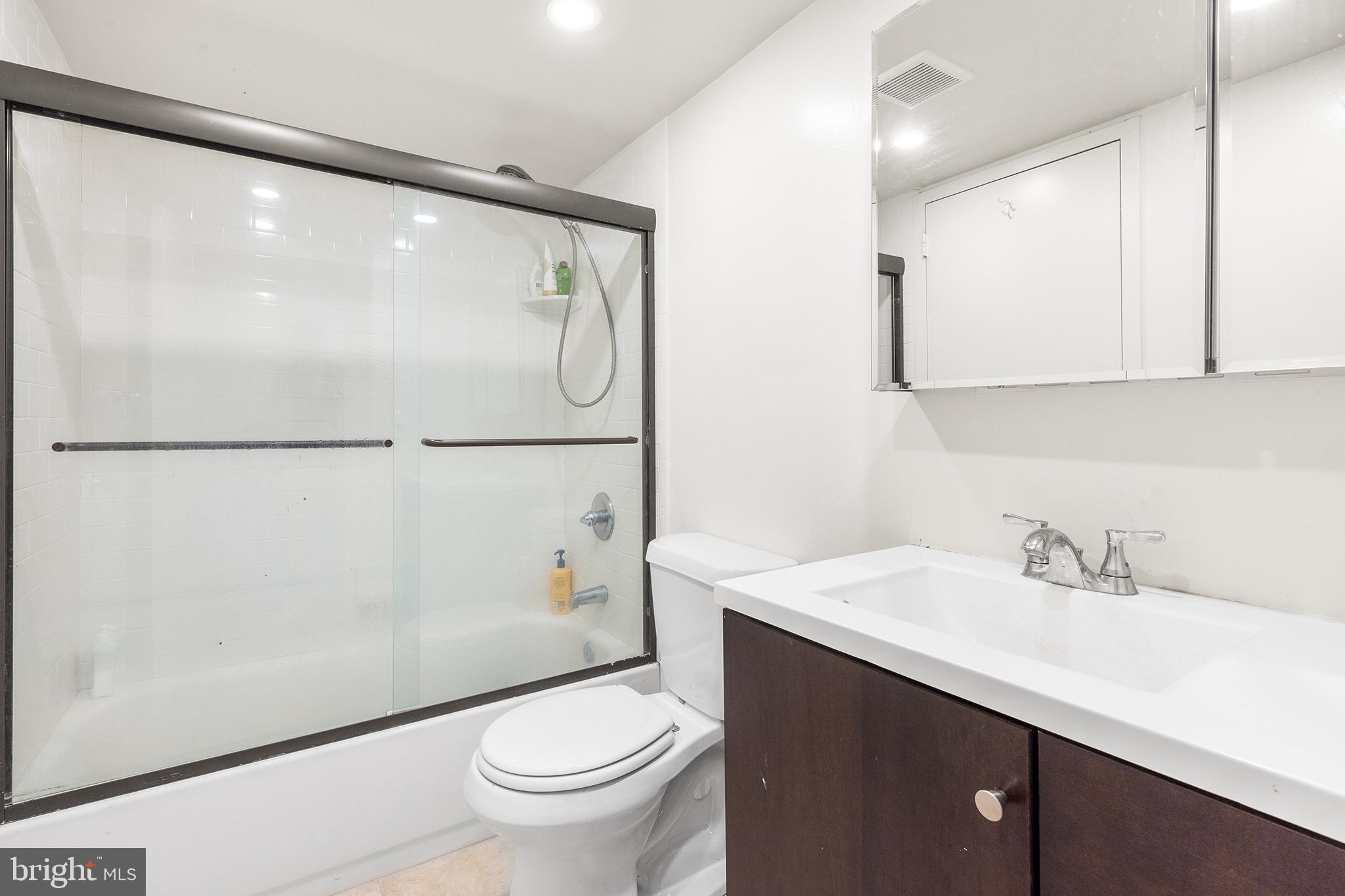 1420 Locust Street, Unit 29J Philadelphia, PA 19102 - Photo 30 of 30 a bathroom with a sink and a mirror