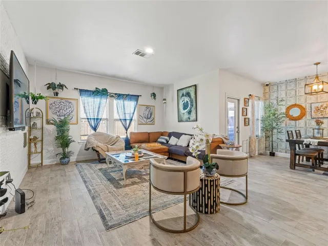 a living room with furniture and a table
