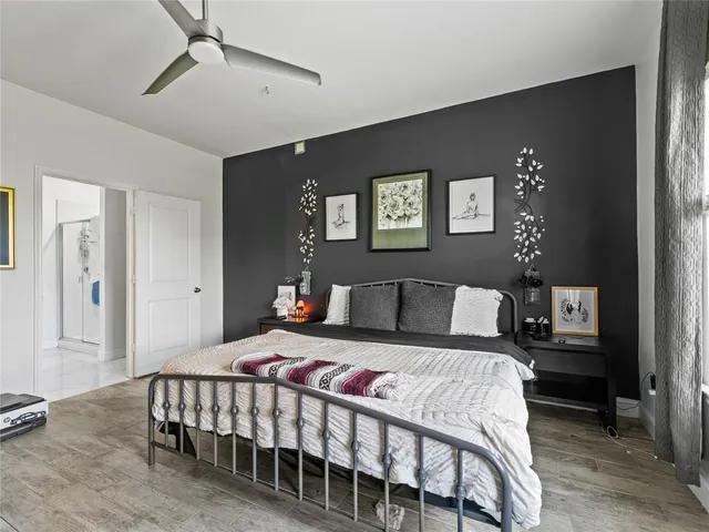 a bedroom with a bed and a table