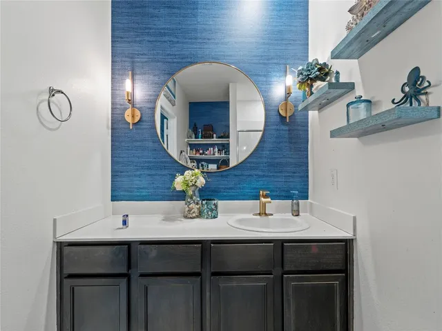 a bathroom with a sink and a mirror