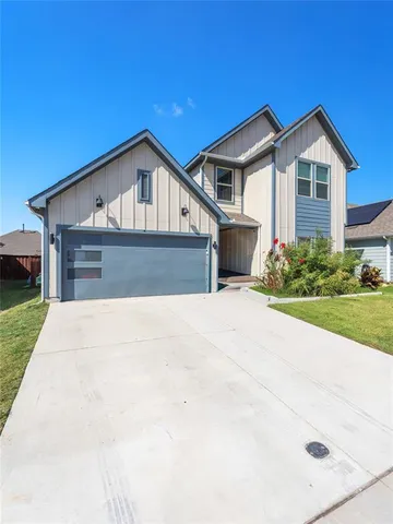 a front view of a house with yard