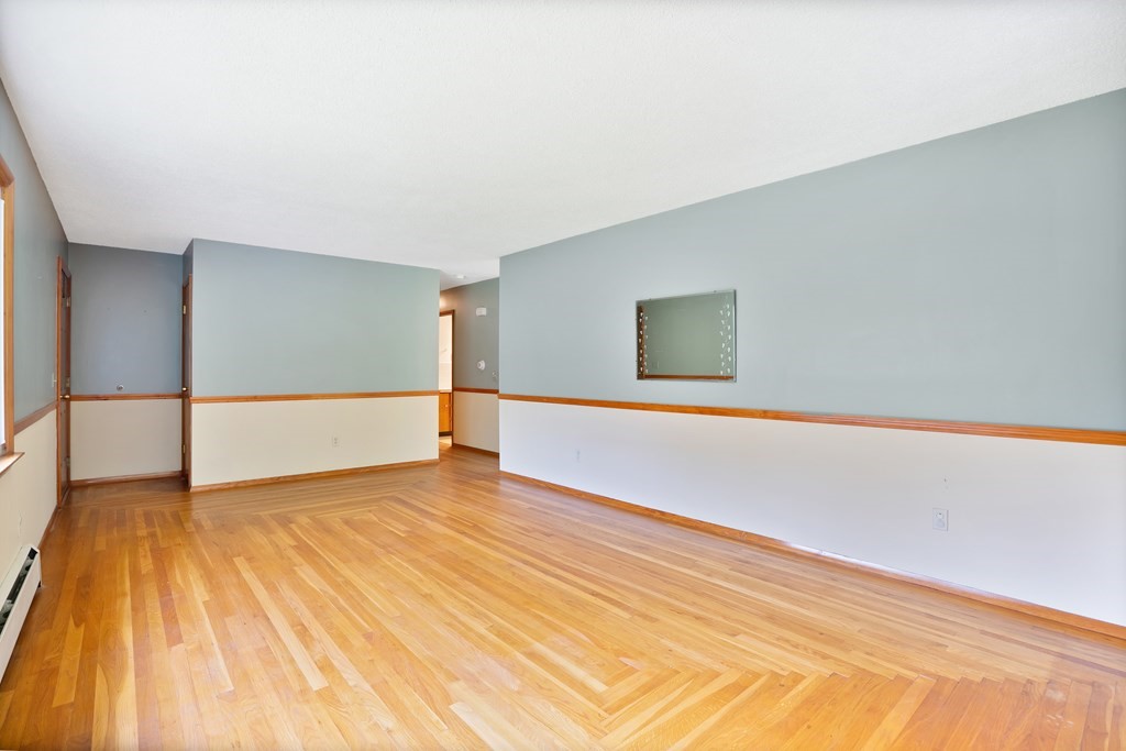 316 Burlingame Road Palmer, MA 01069 - Photo 21 of 31 a view of an empty room with wooden floor