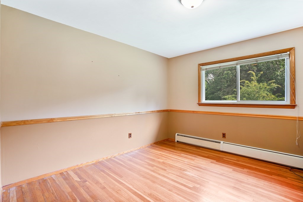 316 Burlingame Road Palmer, MA 01069 - Photo 24 of 31 a view of empty room with wooden floor and fan