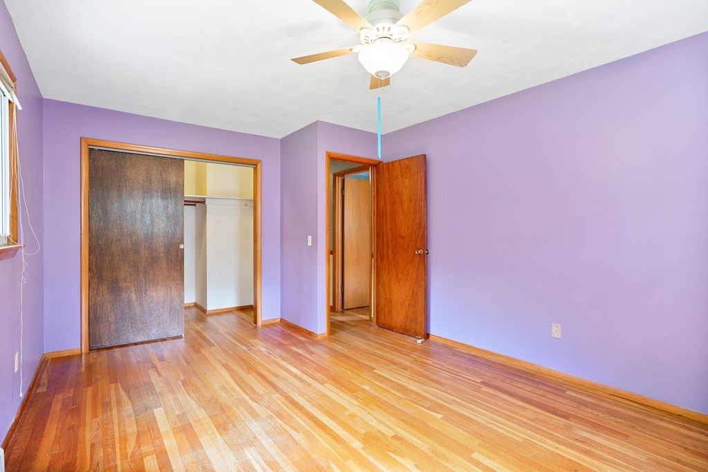 316 Burlingame Road Palmer, MA 01069 - Photo 29 of 31 a view of a room with wooden floor and a ceiling fan