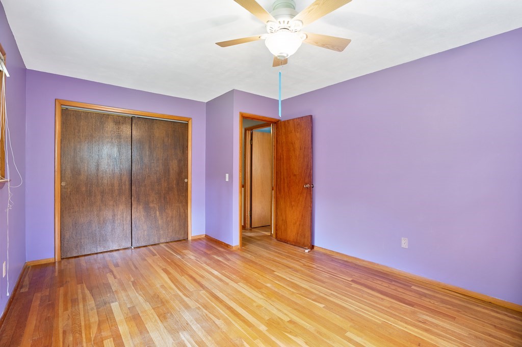 316 Burlingame Road Palmer, MA 01069 - Photo 30 of 31 a view of empty room with a chandelier fan and wooden floor