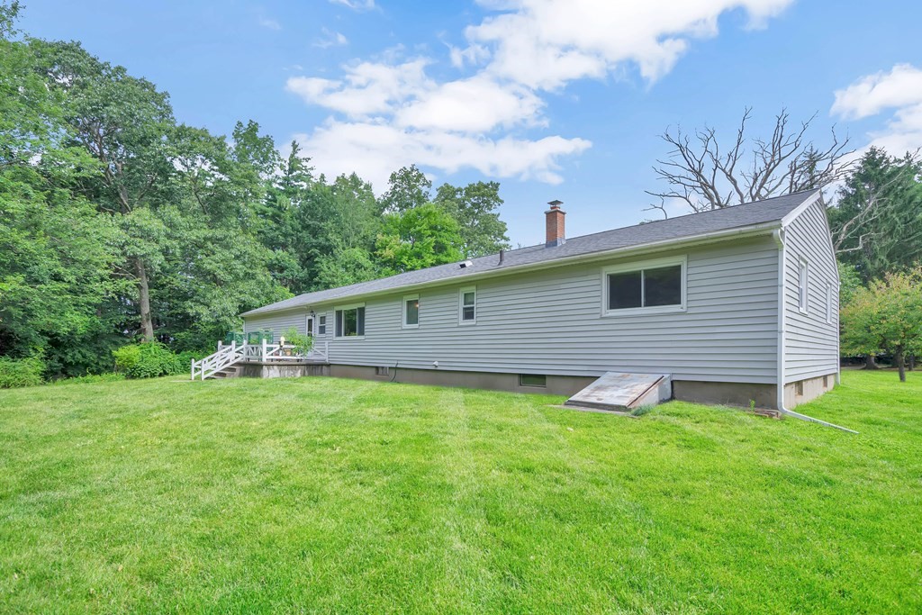 316 Burlingame Road Palmer, MA 01069 - Photo 5 of 31 a backyard of a house with lots of green space