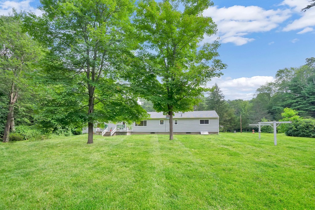 316 Burlingame Road Palmer, MA 01069 - Photo 6 of 31 a house view with a sitting space and garden