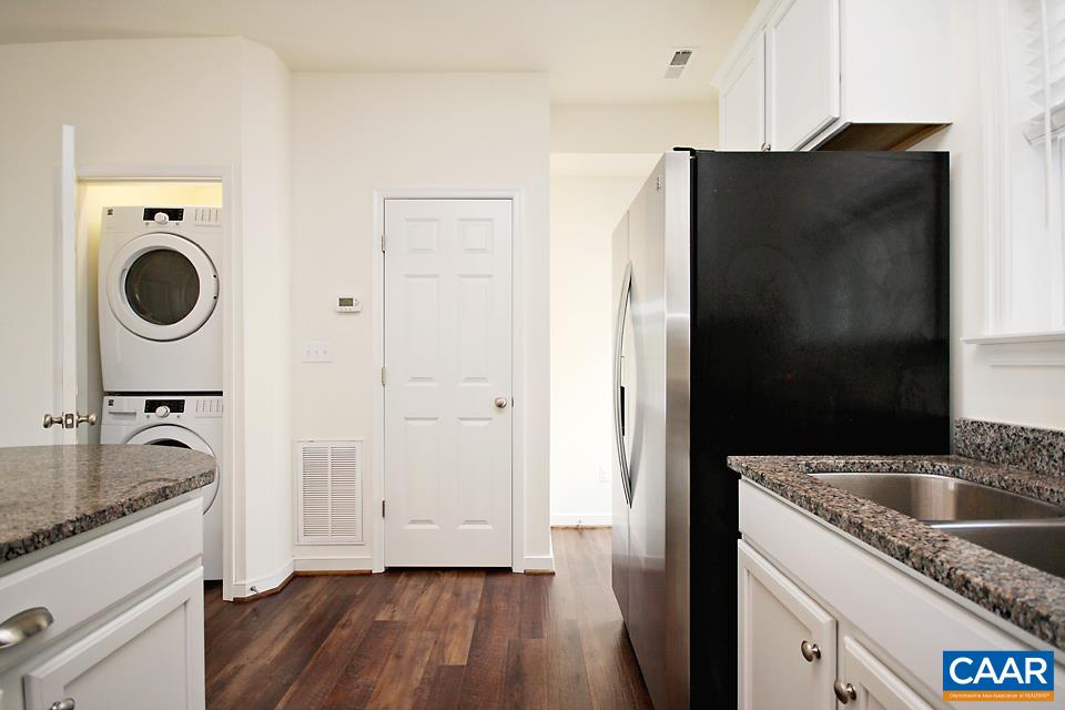 609 Mornington Lane Crozet, VA 22932 - Photo 4 of 17 a kitchen with a refrigerator and a sink