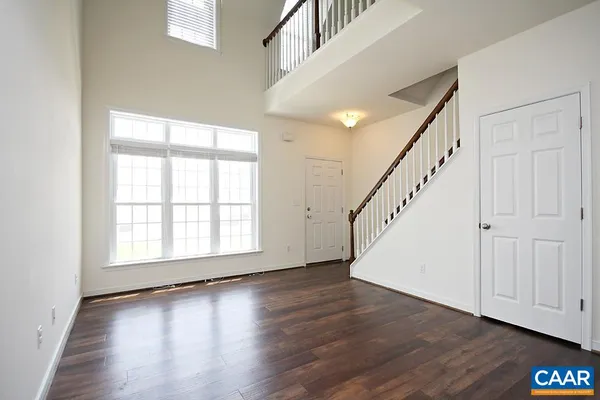 a view of an entryway with wooden floor