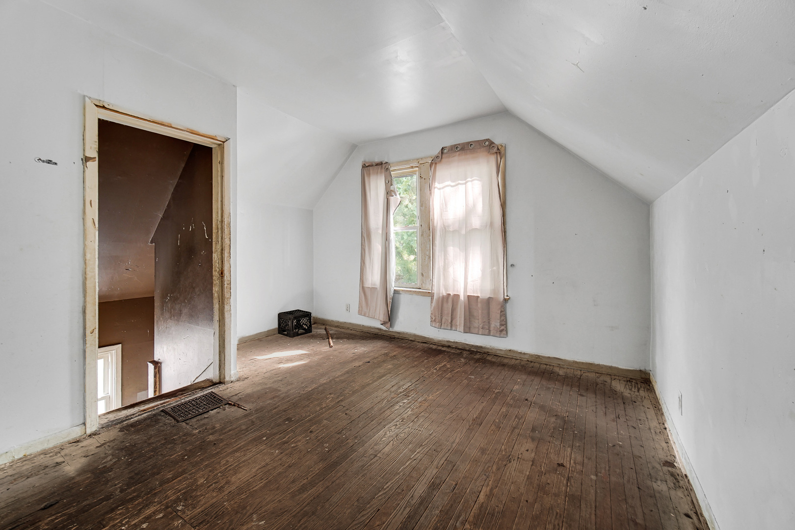 12220 South Normal Avenue Chicago, IL 60628 - Photo 15 of 22 an empty room with wooden floor and windows