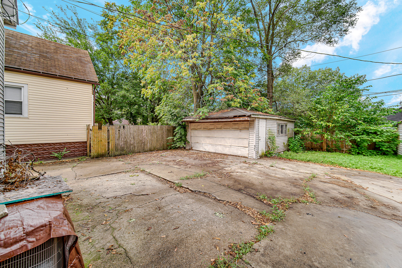 12220 South Normal Avenue Chicago, IL 60628 - Photo 22 of 22 a front view of a house with a yard and garage