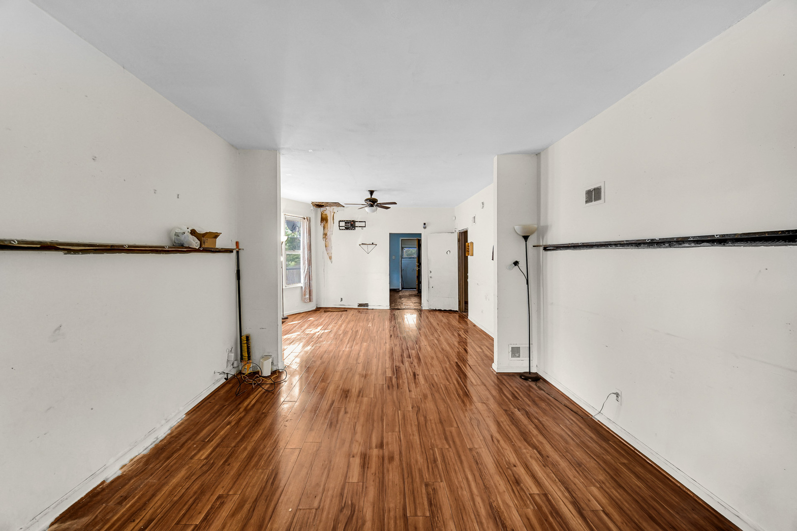 12220 South Normal Avenue Chicago, IL 60628 - Photo 6 of 22 a view of a room with wooden floor