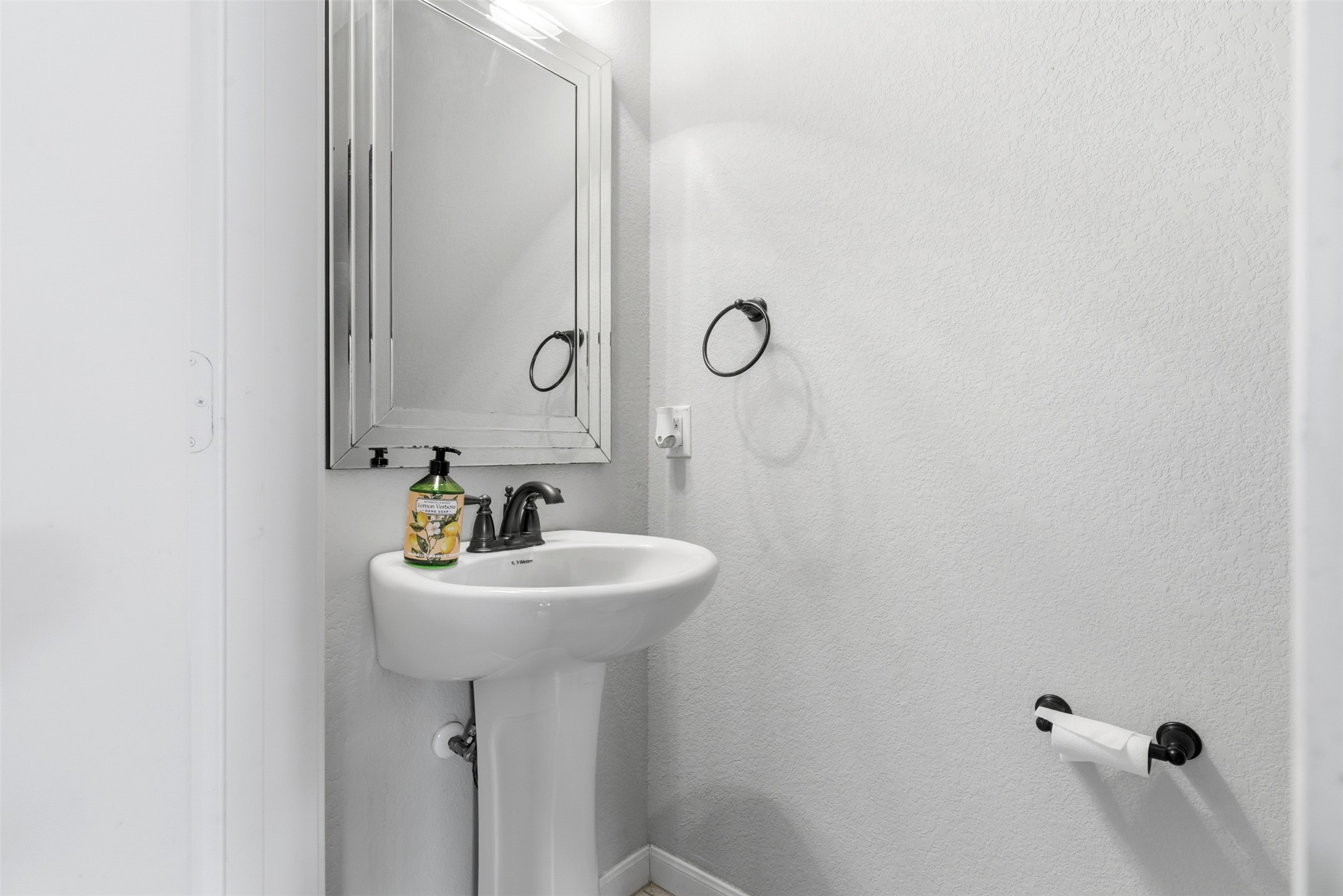 2409 Muzzie Lane Leander, TX 78641 - Photo 14 of 33 a bathroom with a sink a mirror and shower