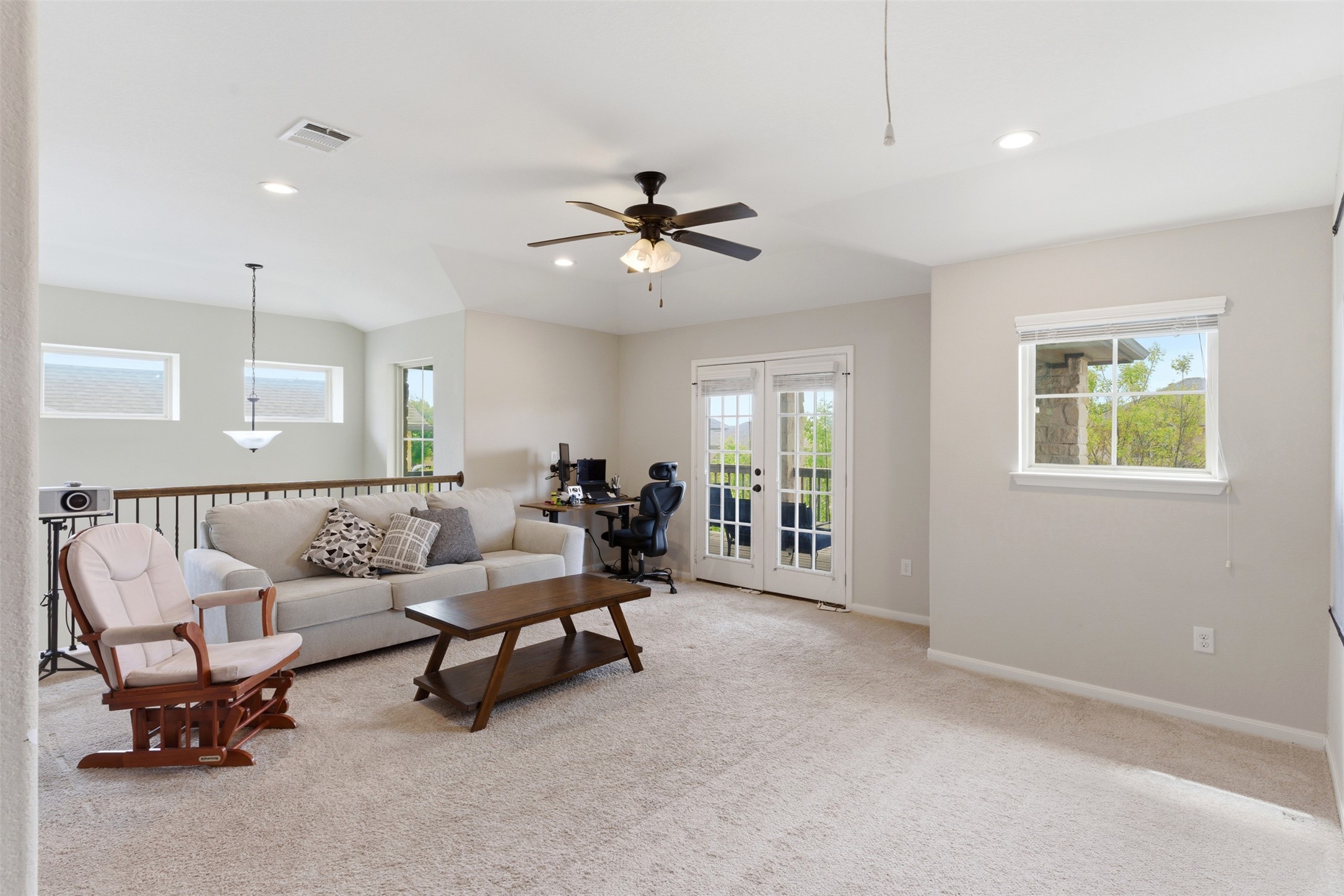 2409 Muzzie Lane Leander, TX 78641 - Photo 15 of 33 a living room with furniture and a chandelier