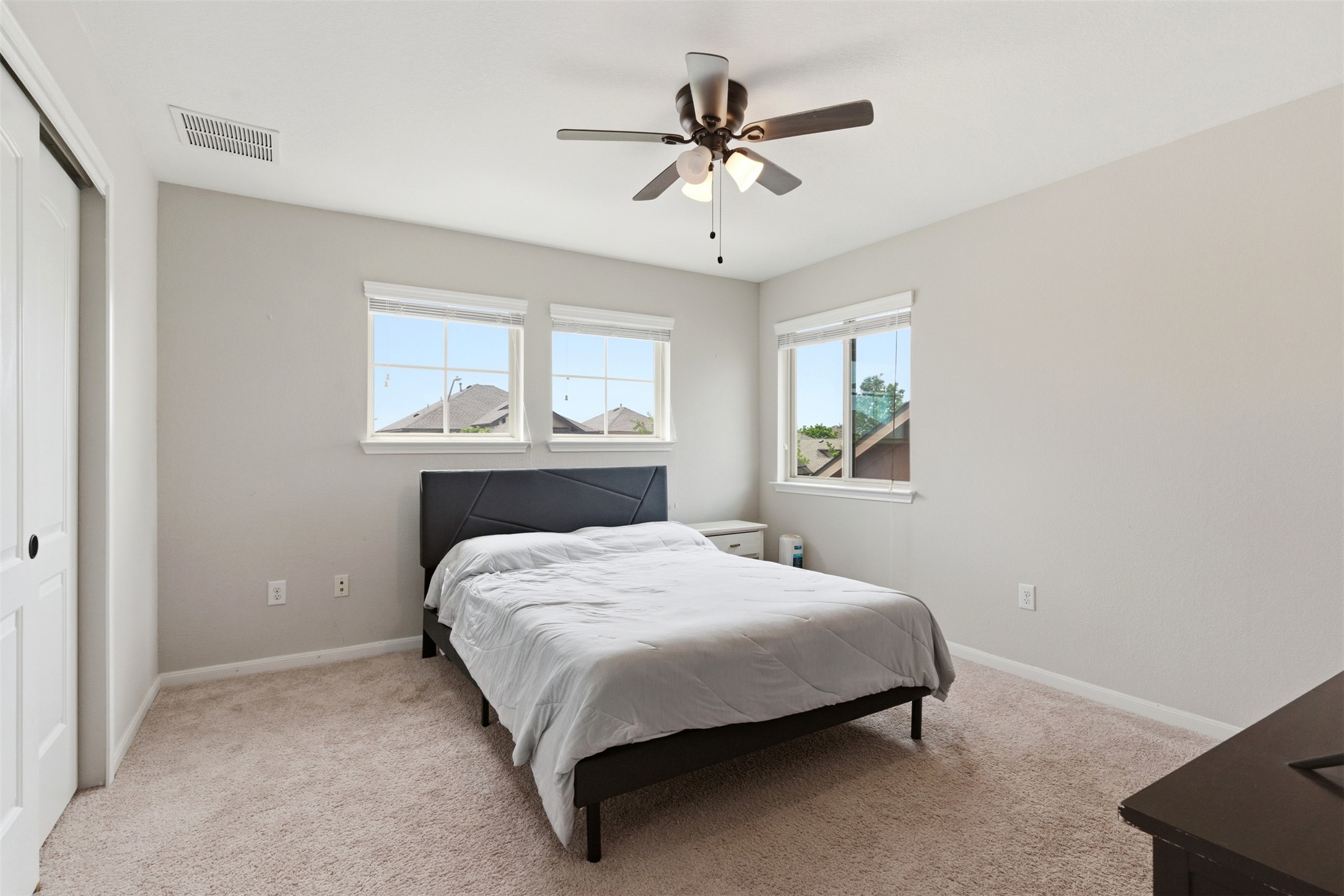 2409 Muzzie Lane Leander, TX 78641 - Photo 16 of 33 a bedroom with a bed and window