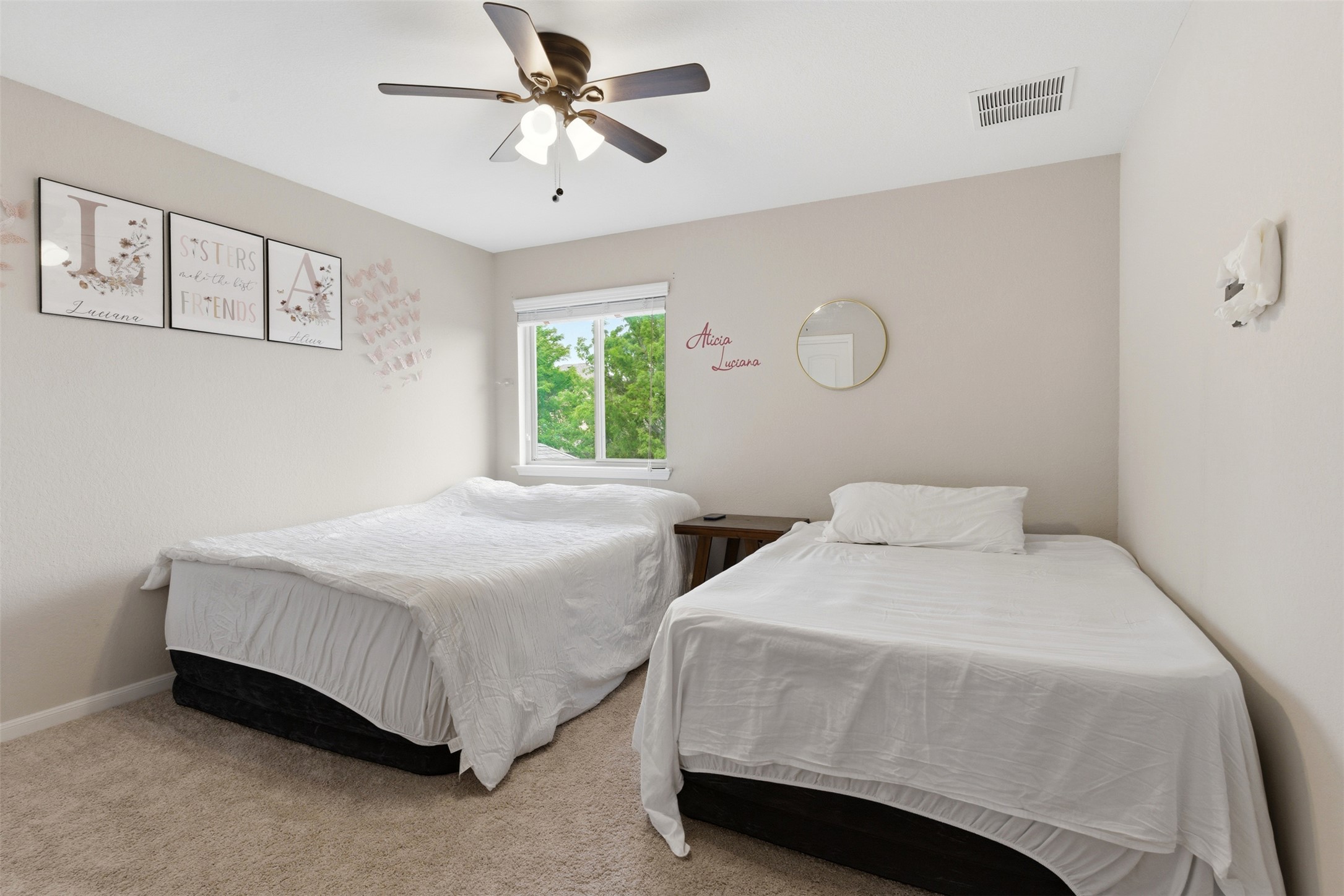 2409 Muzzie Lane Leander, TX 78641 - Photo 19 of 33 a bedroom with a bed and window