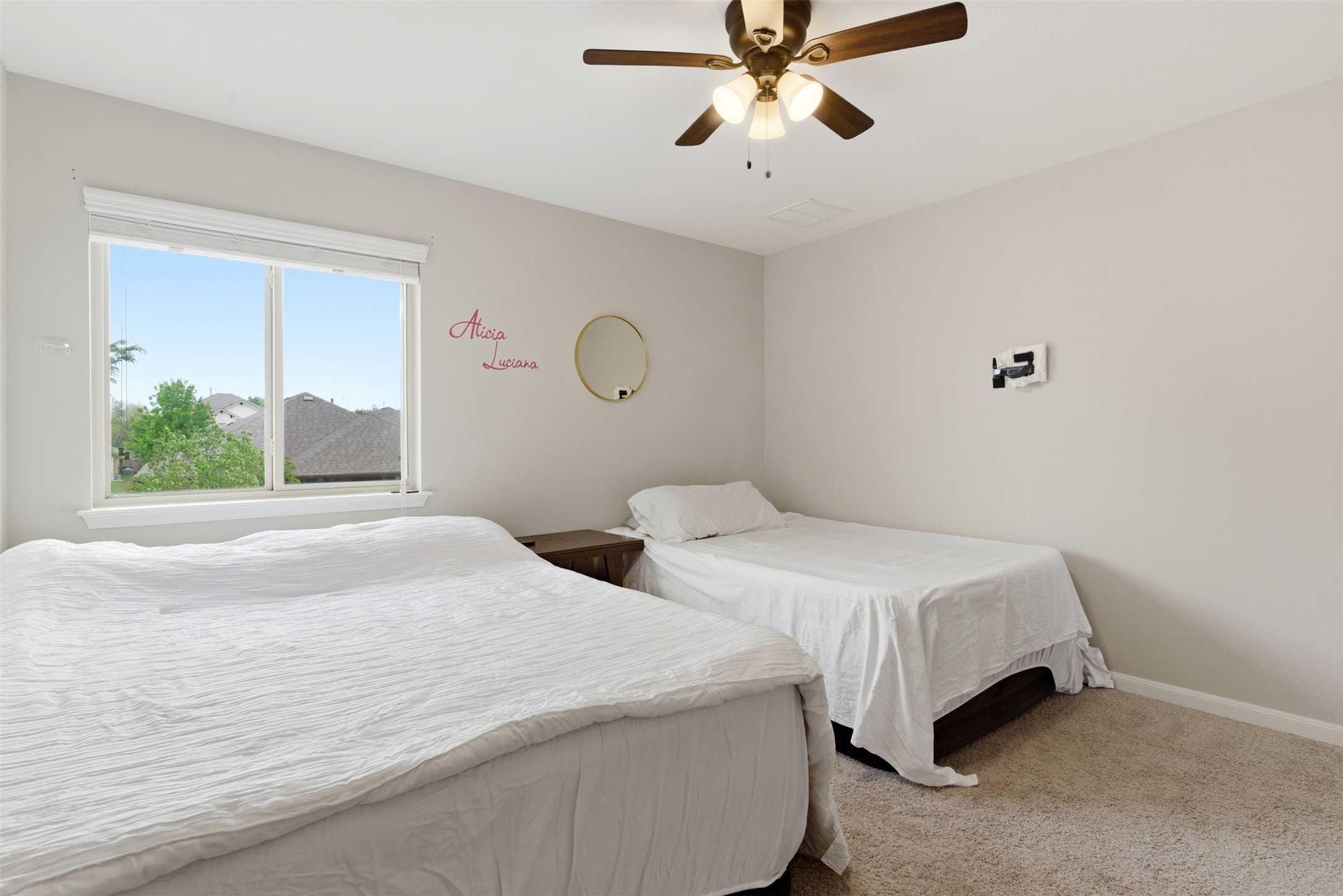 2409 Muzzie Lane Leander, TX 78641 - Photo 20 of 33 a bedroom with a bed and a window