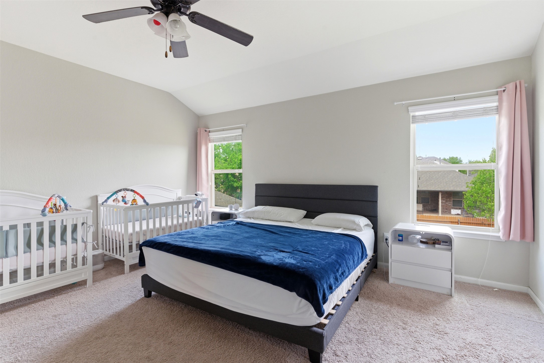 2409 Muzzie Lane Leander, TX 78641 - Photo 21 of 33 a bedroom with a bed and a chandelier