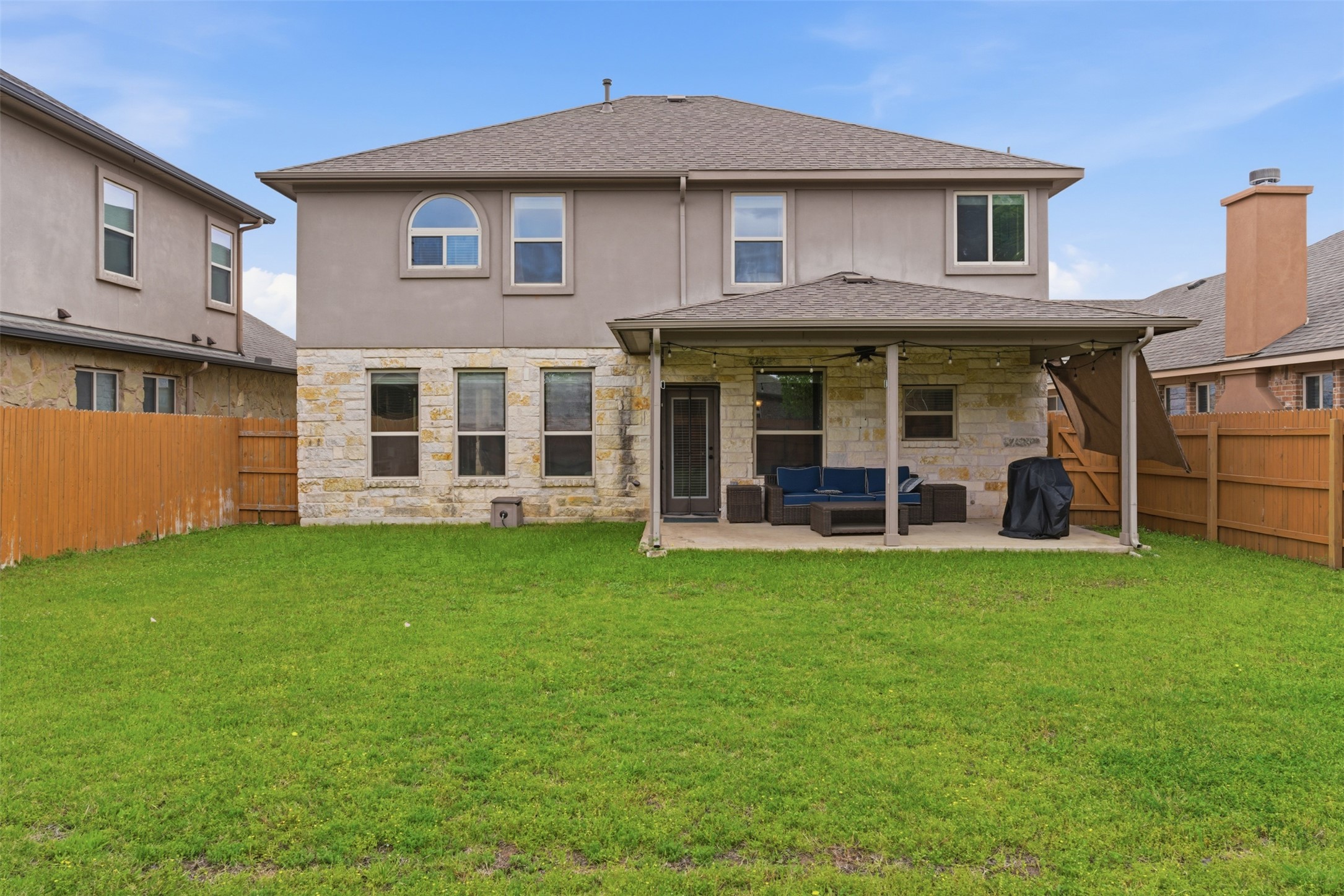 2409 Muzzie Lane Leander, TX 78641 - Photo 28 of 33 a view of a house with a backyard porch and sitting area