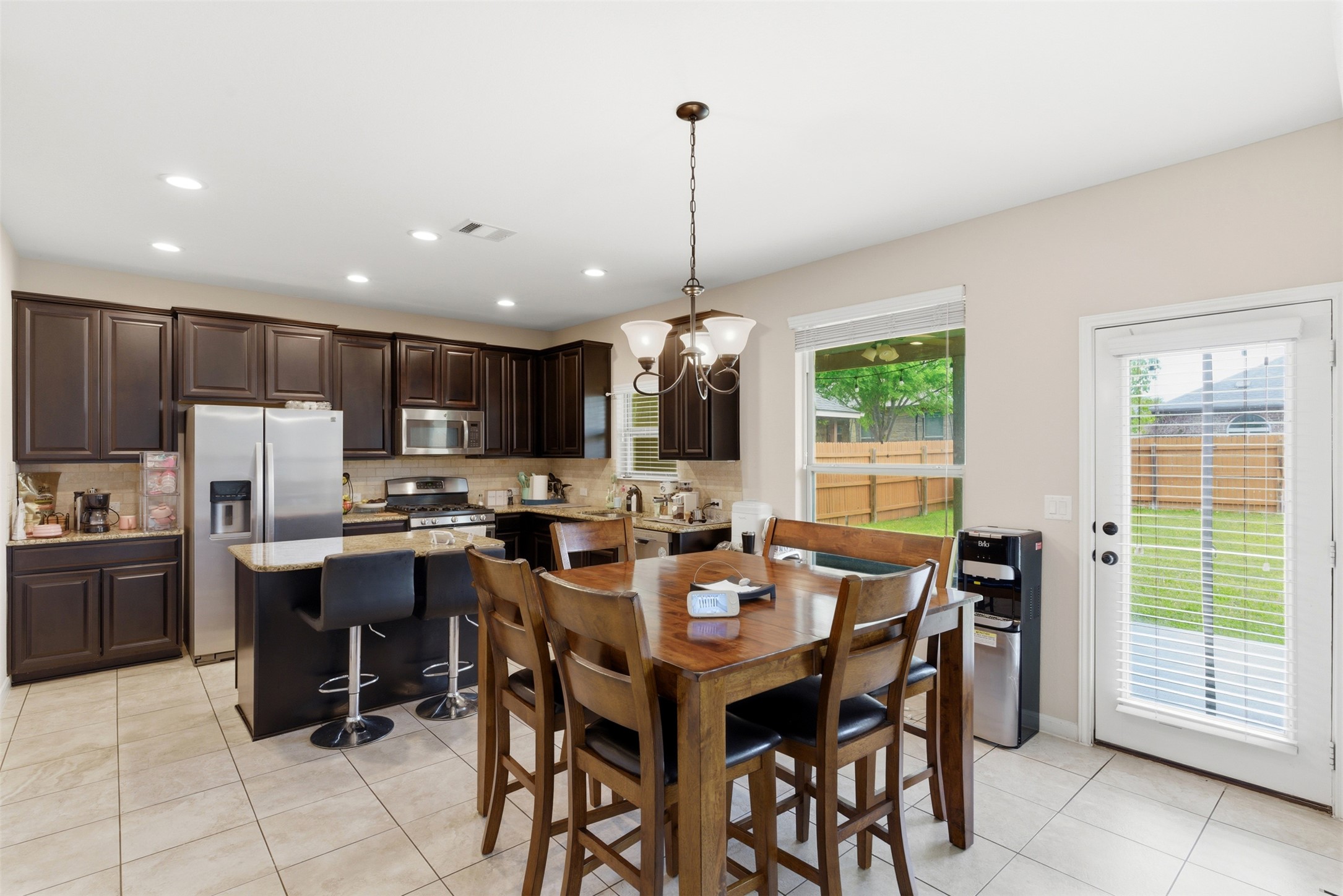2409 Muzzie Lane Leander, TX 78641 - Photo 9 of 33 a view of a dining room with furniture