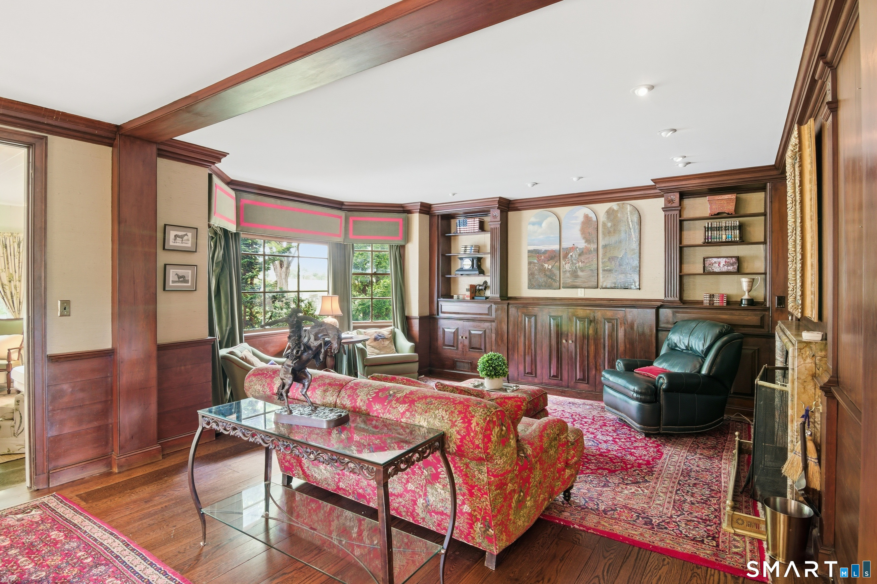433 Wrights Crossing Road Pomfret, CT 06259 - Photo 10 of 36 Presenting the Club Room, an inviting space designed for post-dinner conversations and refreshments. Explore the hidden bar concealed behind the wall, a relic from the Prohibition era.