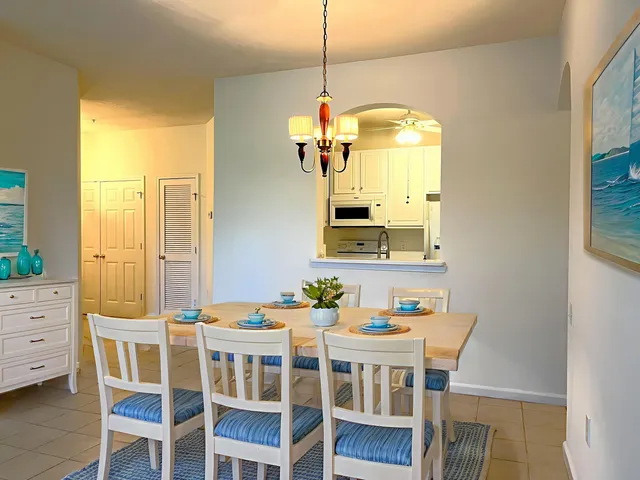 a dining room with furniture and window
