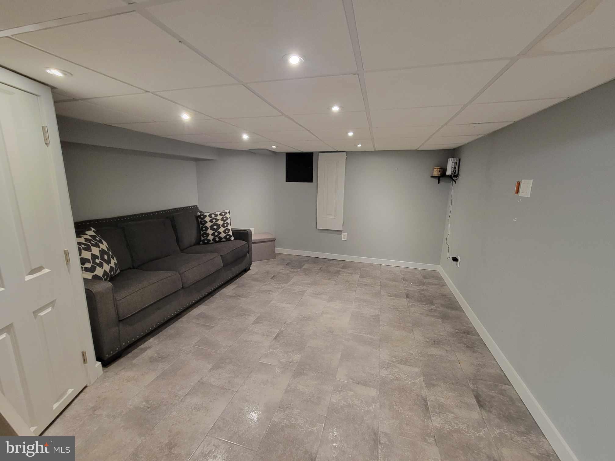 3537 Sunnyside Avenue Philadelphia, PA 19129 - Photo 6 of 12 a living room with furniture and a ceiling fan