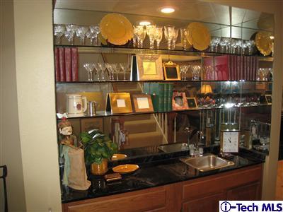 Undisclosed Address Burbank, CA 91501 - Photo 8 of 21 a kitchen area with lots of counter top space and wooden floor