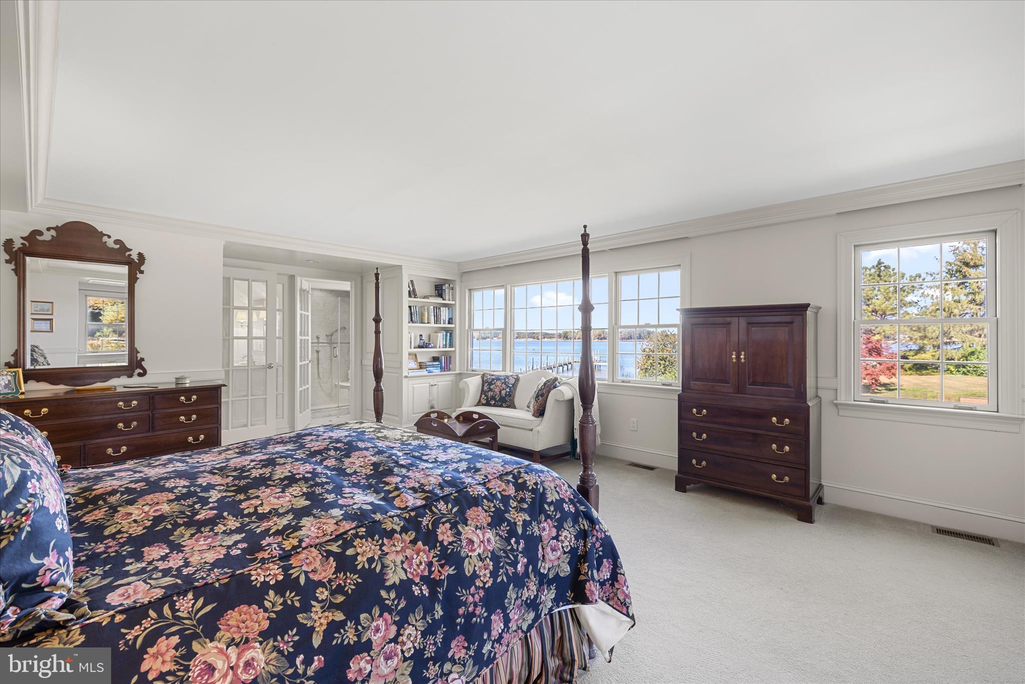27473 Westpoint Road Easton, MD 21601 - Photo 23 of 58 a bedroom with a bed and wooden floor