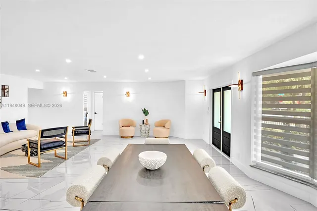 a living room with furniture and a rug