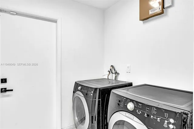 a bathroom with a shower curtain and a sink