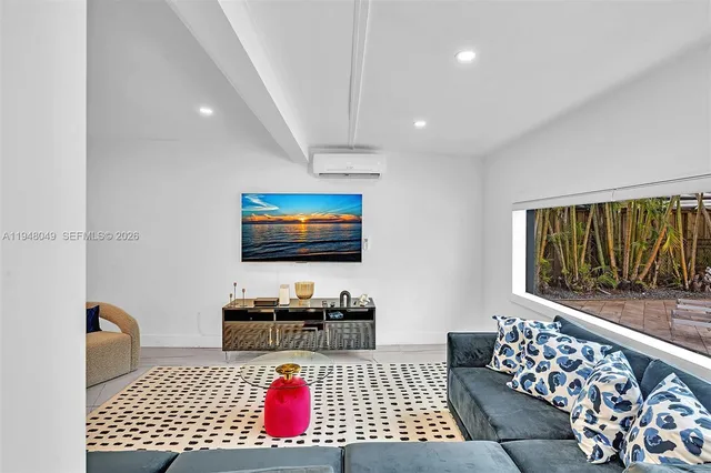 a bathroom with a sink a toilet and shower curtain