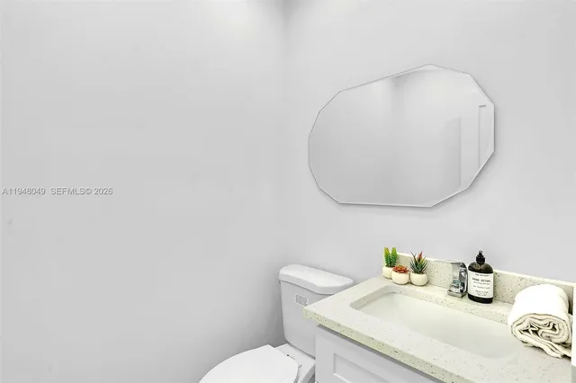 a bedroom with a bed and flat screen tv