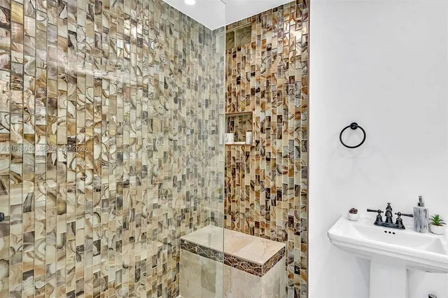 an aerial view of a house with garden space and outdoor seating