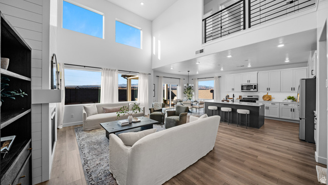324 North Rhyolite Drive, Unit 87 Hurricane, UT 84737 - Photo 6 of 33 Living room featuring recessed lighting, dark wood-style flooring, and a high ceiling
