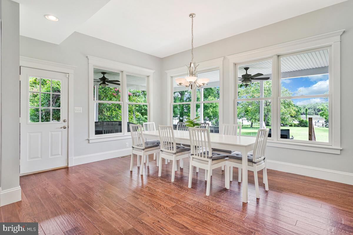 50333 Scotland Beach Road Scotland, MD 20687 - Photo 18 of 95 a view of a dining room with furniture window and wooden floor