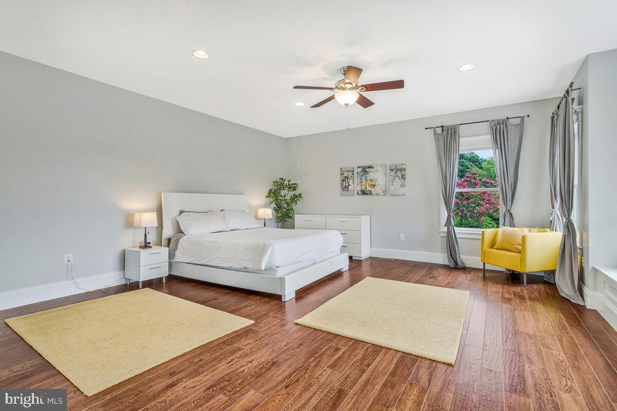 50333 Scotland Beach Road Scotland, MD 20687 - Photo 27 of 95 a bedroom with a bed and wooden floor