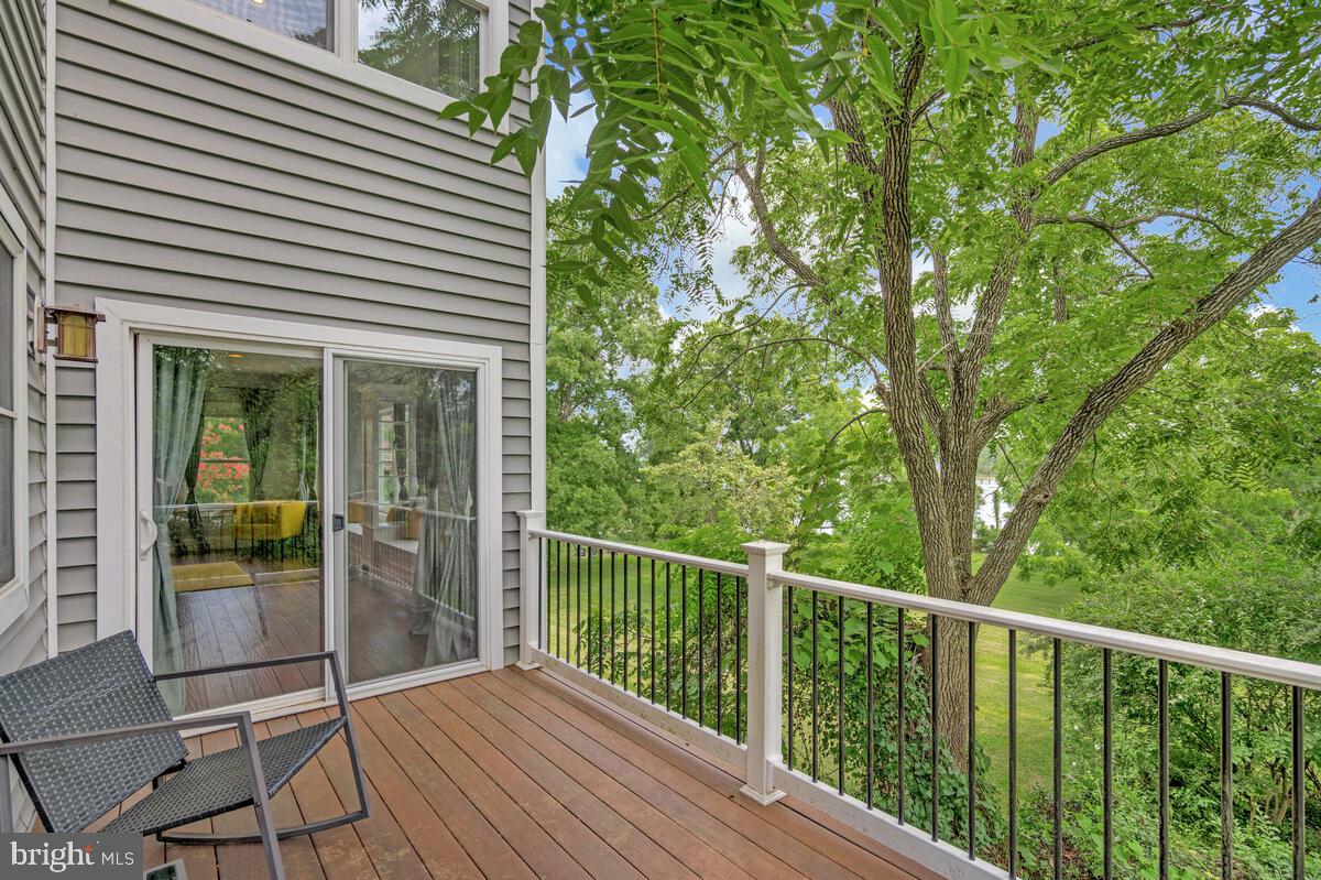 50333 Scotland Beach Road Scotland, MD 20687 - Photo 32 of 95 a view of a balcony with floor to ceiling window and wooden fence