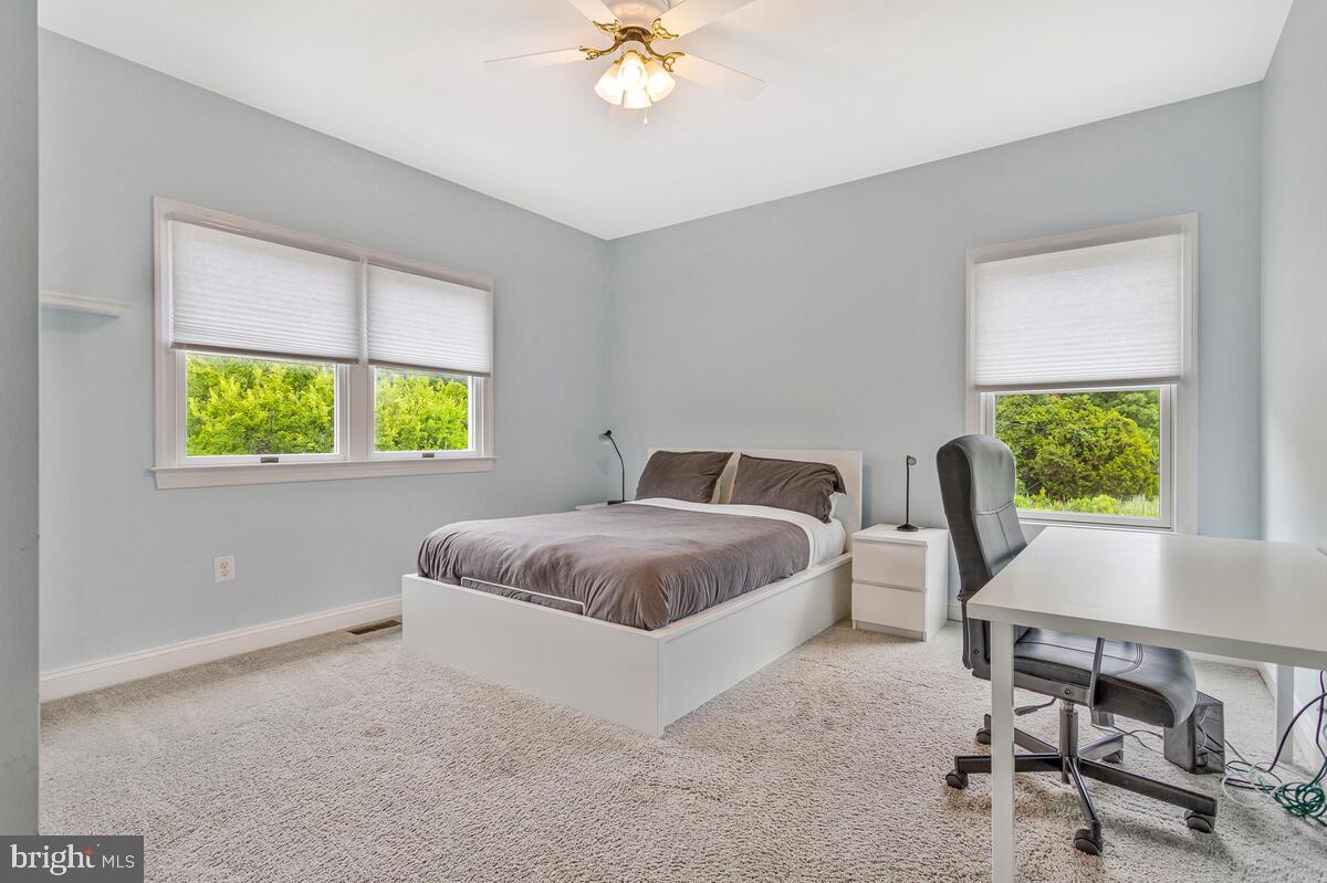 50333 Scotland Beach Road Scotland, MD 20687 - Photo 36 of 95 a living room with a bed furniture and a window