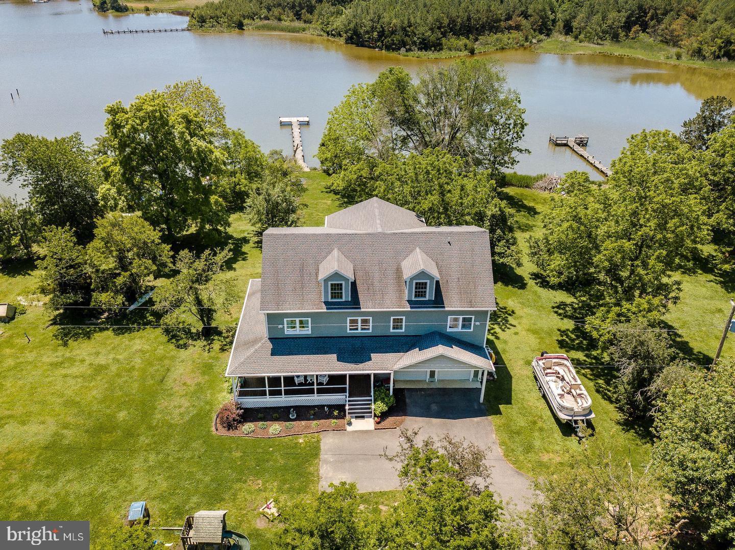 50333 Scotland Beach Road Scotland, MD 20687 - Photo 84 of 95 an aerial view of a house with swimming pool and lake view