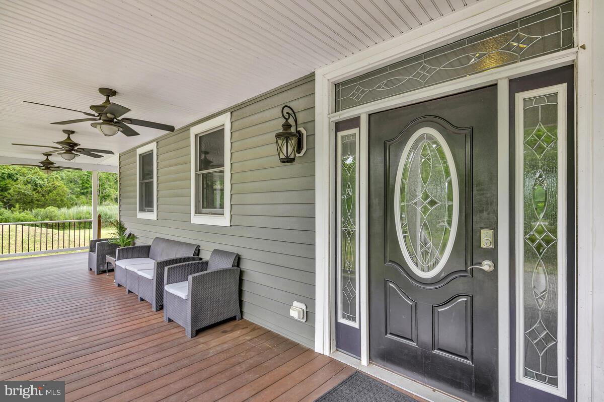 50333 Scotland Beach Road Scotland, MD 20687 - Photo 9 of 95 a view of a house with wooden floor and wooden fence