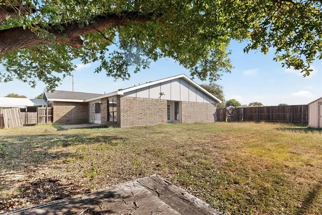 a view of backyard and tree