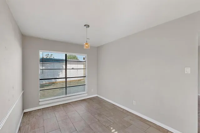 a kitchen with a stove top oven and cabinets